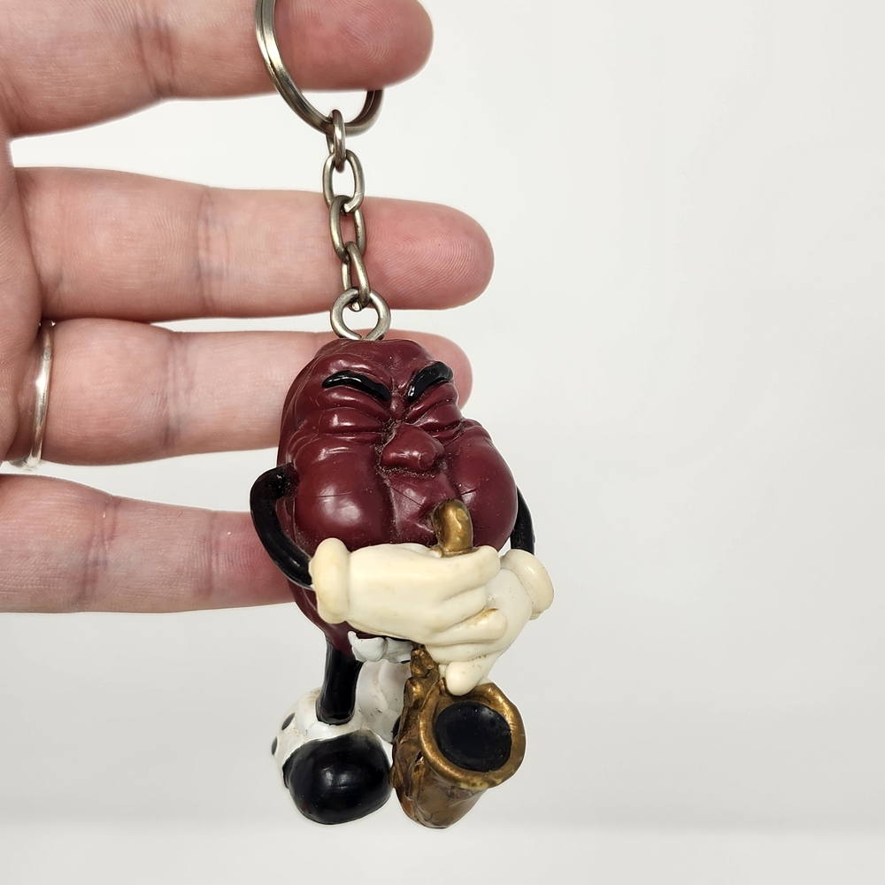Vintage California Raisin Keychain with Saxaphone 2 1/2 inches Tall Pvc